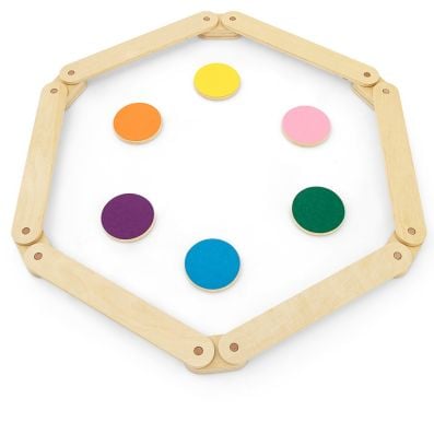 Colorful stepping stones arranged in a hexagon with wooden balance beams, perfect for kids' imaginative play and.