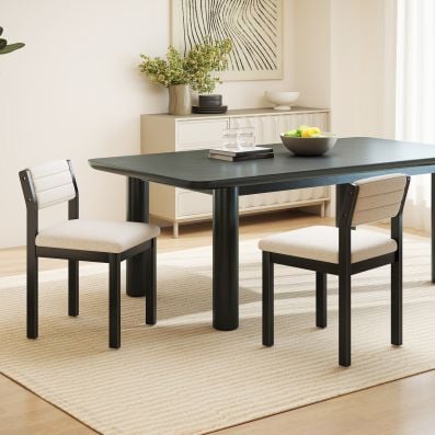 Two dining chairs with imitation lamb fleece upholstery and rubber wood legs, perfect for dining rooms or living spaces.