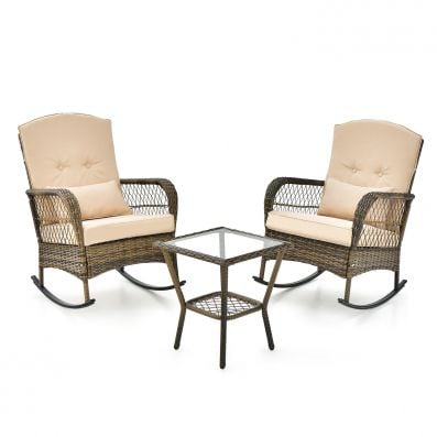 Two beige cushioned rocking chairs with a glass-top coffee table, perfect for outdoor relaxation and comfort.