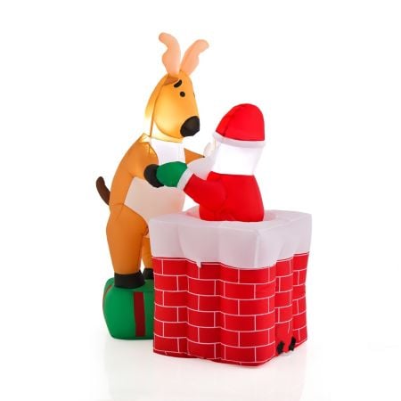 Inflatable Santa Claus climbing chimney with reindeer on gift box, featuring bright LED lights for festive outdoor.