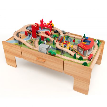 Colorful wooden train track set with 100 pieces on a reversible tabletop, featuring a storage drawer for kids' toys.