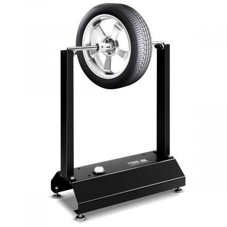 Motorcycle wheel balancer with adjustable centering cones, sturdy steel construction, ideal for bike and car wheels.