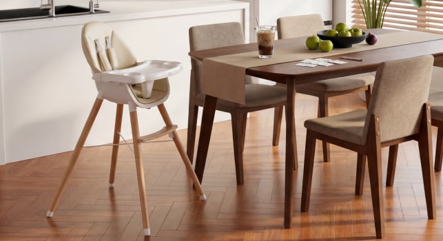 A child's high chair sits beside the table